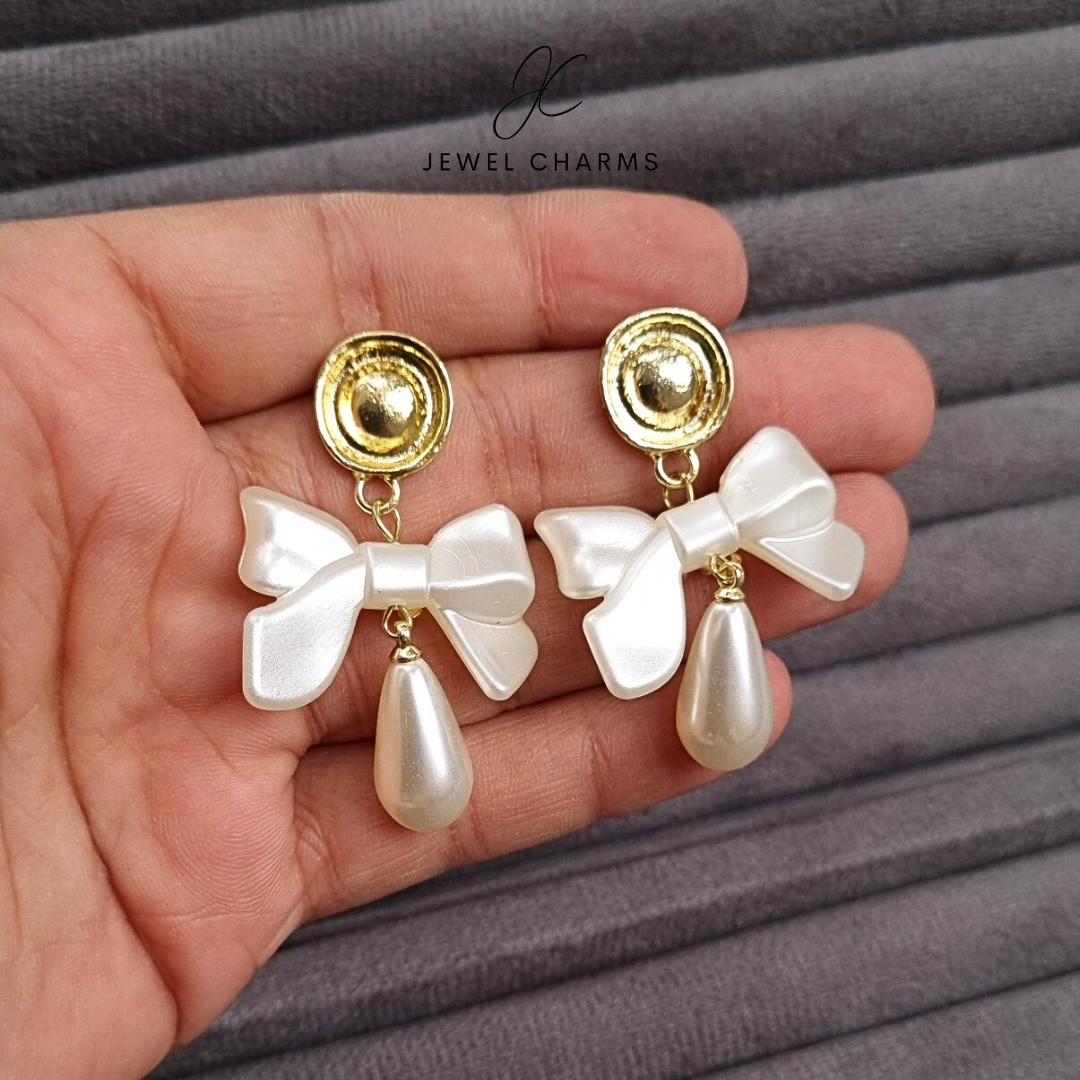Golden hanging pearl bow earrings JCEC 20