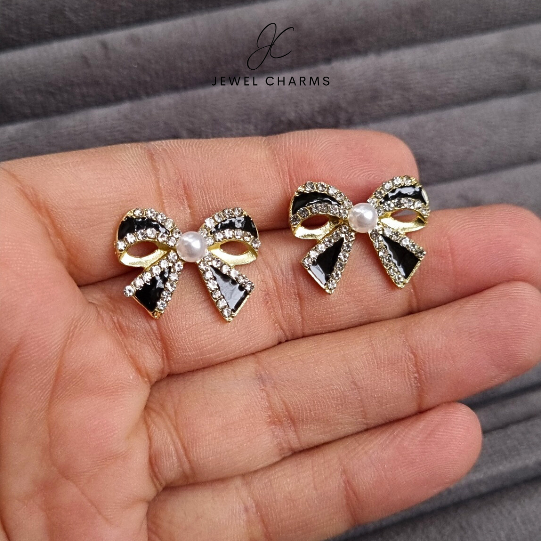 Black bow pearl earrings