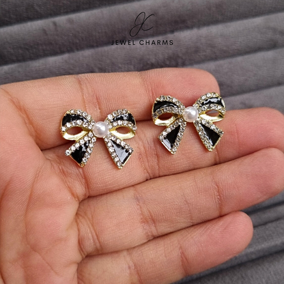 Black bow pearl earrings